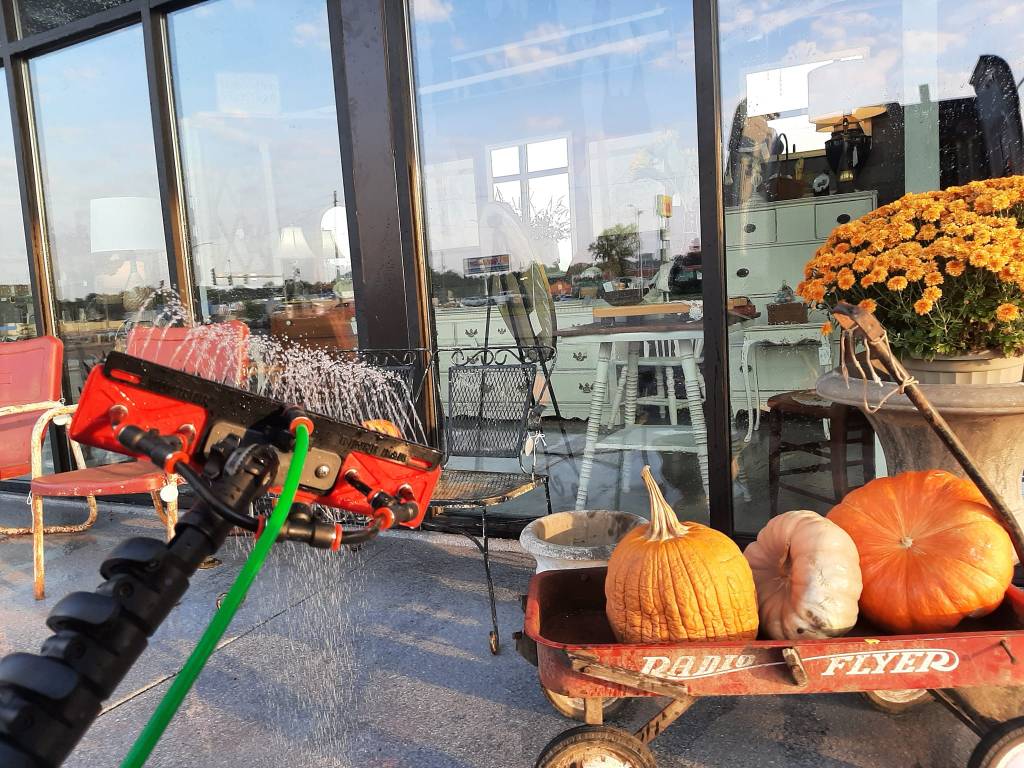 Window washing in NWA using waterfedpole on local storefront.